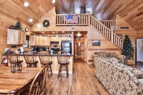 a living room with a table and chairs in a cabin at Shady Lane Lodge in Eagle River