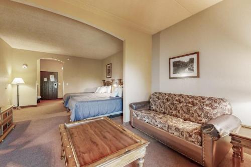 a living room with a couch and a bed at Chula Vista Condo Unit 2647 in Wisconsin Dells
