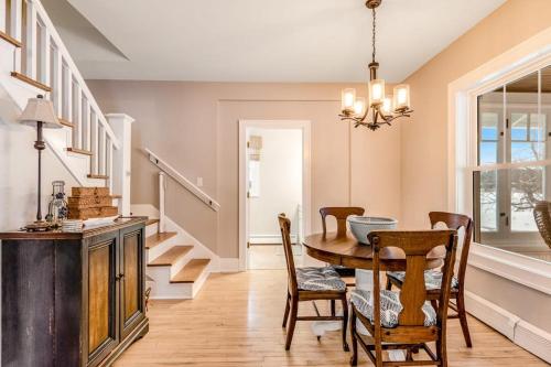 a dining room with a table and chairs at The Blue Cottage in Minocqua