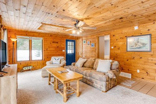 a living room with a couch and a table at The Haven in Eagle River