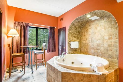 a large bathroom with a tub and a table at Chula Vista Condo 2251 in Wisconsin Dells
