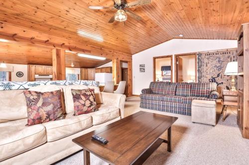 a living room with a couch and a table at Watermelon Retreat in Three Lakes