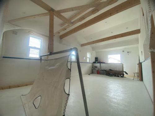 a room with a skateboard ramp in a building at Magical Skate Casa in Wakayama