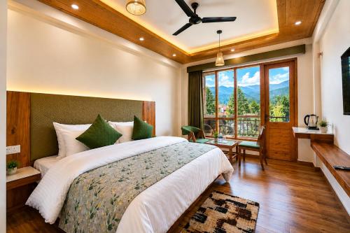 a bedroom with a large bed and a large window at The Alpine Escape, Manali - A Beautiful Cottage in Cloud's in Manāli