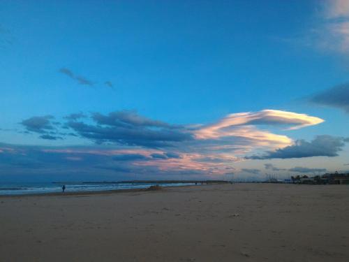 a cloud formation in the sky over a beach at B&B Adriatico in Giulianova