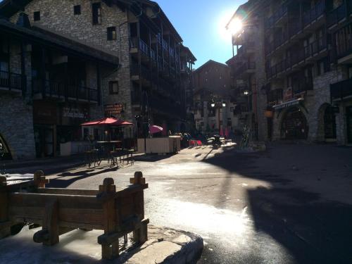 an empty street in a city with buildings at Appartement vue 180° sur massif in Val dʼIsère