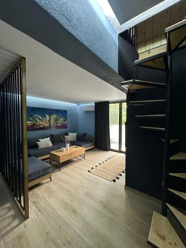 a living room with a couch and a table at 26 Villa Katerina, Elani in Elani