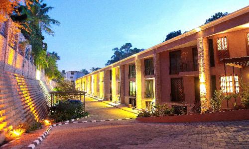 a large building with lights on the side of it at Acacia Green Service Apartments in Kampala