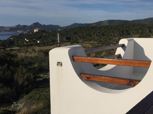 a balcony of a house with a view of the ocean at L'Olla in Cala Ratjada