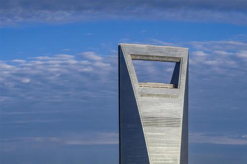 a tall building with a window in the sky at Park Hyatt Shanghai in Shanghai