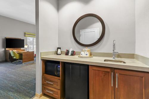 a bathroom with a sink and a mirror at Hampton Inn & Suites El Paso West in Borderland