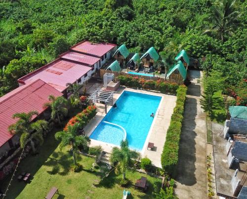 an aerial view of a resort with a swimming pool at Itawis Resort - Nature Chalet in Silang