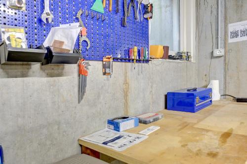 a room with a counter and a wall with blue tiles at Bike Apartments Curti - Abendrot in Laives