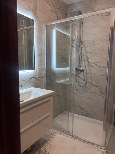 a bathroom with a shower and a sink at Apartment Zekija in Barbat na Rabu