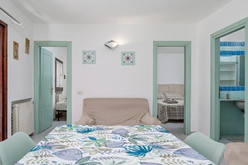 a bedroom with a bed in a room at Villa Rosa in Olbia
