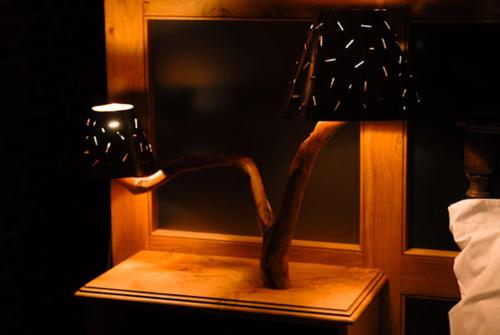 a lamp sitting on a table next to a window at Swan House in Beccles