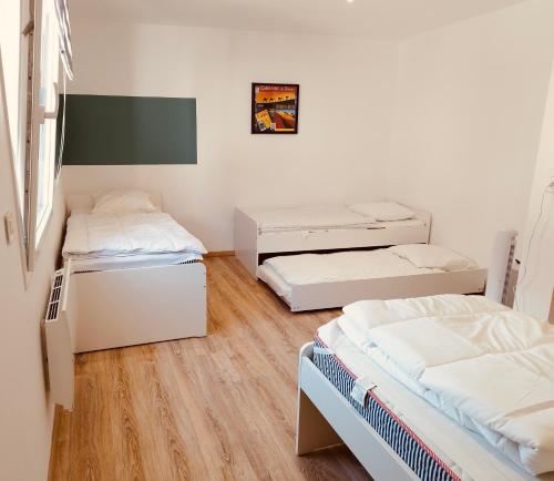a room with two beds and two trunks at Gîtel'harmonie2 in Fraize