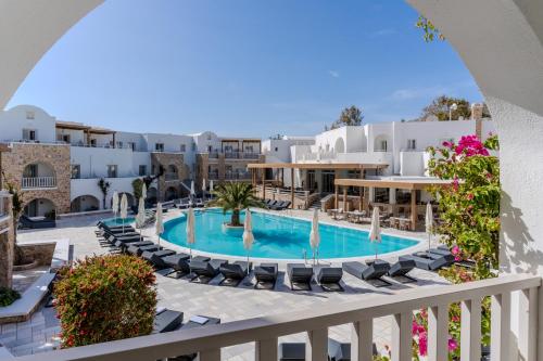 a view of the pool from the balcony of a resort at Aegean Plaza Hotel in Kamari