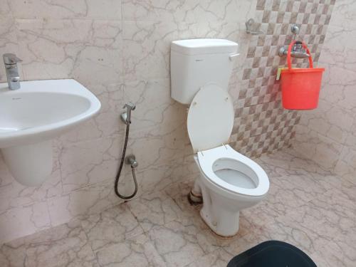 a bathroom with a toilet and a sink at A2 Guest House in Salt Lake City