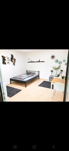 a room with two beds and a chair in it at Ulmer Nestchen in Ulm