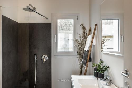 a bathroom with a shower and a sink and a shower at Elaia Bioglam Relais in Casa Modica