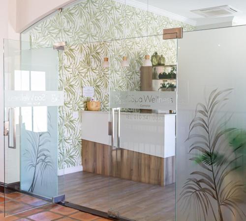 a room with a kitchen with a counter at Winelands Golf Lodges 10 in Stellenbosch