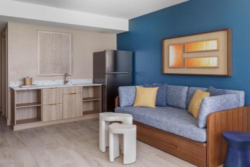a living room with a couch and a kitchen at Three Waters Resort and Marina, Islamorada, a Tribute Portfolio Resort in Islamorada