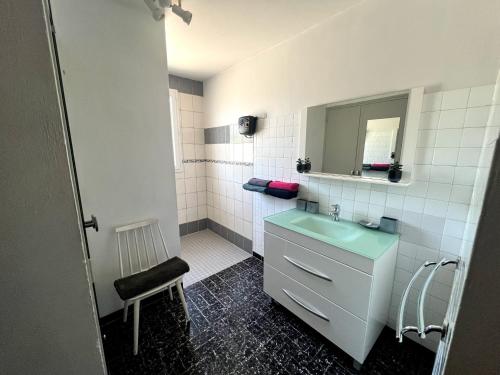 a bathroom with a sink and a mirror at Les oliviers du pradon in Lagarde-Paréol