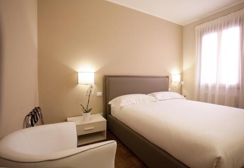 Ένα ή περισσότερα κρεβάτια σε δωμάτιο στο Residence "Le Casette"