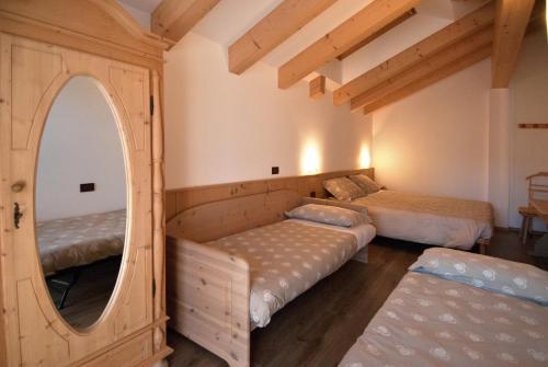 Postel nebo postele na pokoji v ubytování Residence Garni Manuela