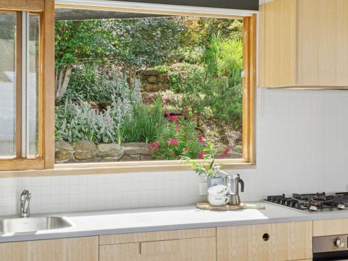 a kitchen with a sink and a window at Wye View in Wye River