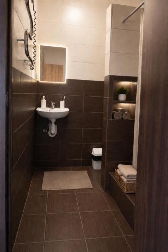 a bathroom with a sink and a toilet at Mia Hotel in Rivne