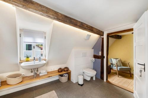 a bathroom with a sink and a toilet at Ferienhaus Gerbertor am Goldbach in Dörzbach