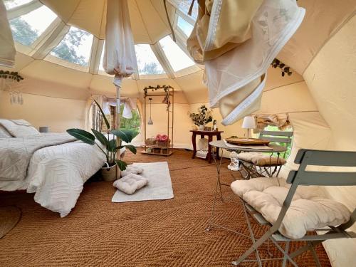 a bedroom with a bed and an attic at Les Gîtes et la Chambre de Labahou SPA in Anduze