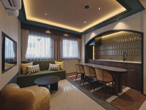 a living room with a couch and a table at illi Harb Shibuya-Ebisu in Tokyo