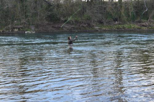 a person standing in the water in a river at L'Escalère in Arnaud-Guilhem