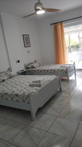 Llit o llits en una habitació de ΠΑΓΩΝΗΣ studios