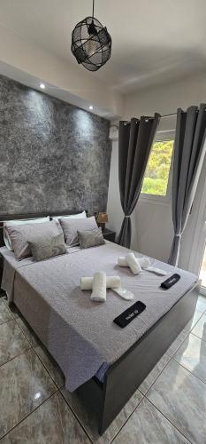 a bedroom with a large bed in a room at Alma-Libre house 2 in Kefalos