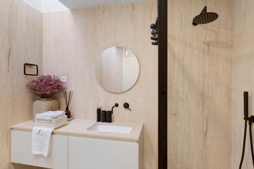 a bathroom with a sink and a mirror at Viana Vista Villa in Viana do Castelo
