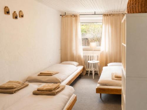 a room with three beds and a window at Seč Aktivně in Seč