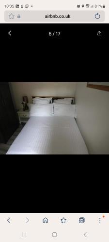 a picture of a bedroom with a white bed at COMFY GUEST suite in Dartford