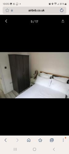 a picture of a bedroom with a white bed at COMFY GUEST suite in Dartford