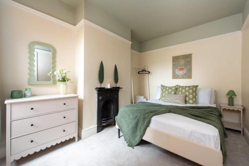 a bedroom with a bed and a fireplace at Spacious 3 Bed In Rugby in Rugby