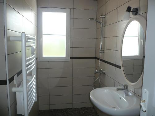 a bathroom with a sink and a mirror at Gite Karrikartea in Saint-Pée-sur-Nivelle