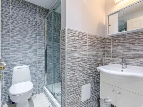 a bathroom with a toilet and a sink at 1 Bed in Cinderford oc-82884 in Cinderford