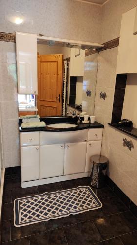 a kitchen with a sink and a counter top at Grossberghütte - Altfasstal in Mühlbach