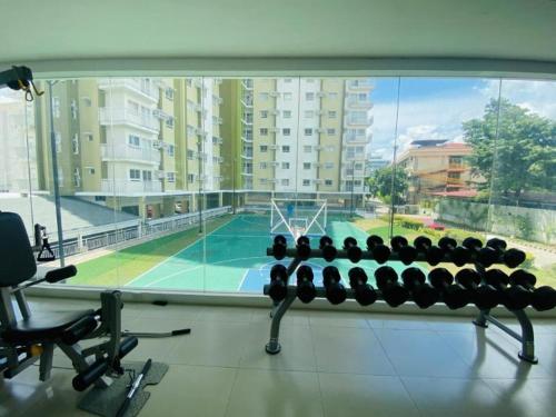 a gym with a basketball court in a building at D Grey Pillows - 16th Floor One-Bedroom Condo Unit with Sea View in Pontud