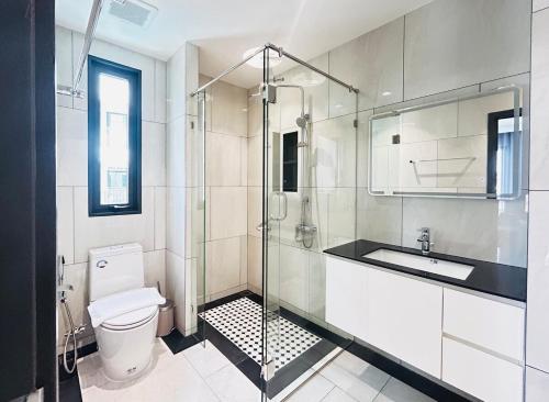 a bathroom with a shower and a toilet and a sink at Legendary 2 Bdr Comfort in Bang Tao Beach