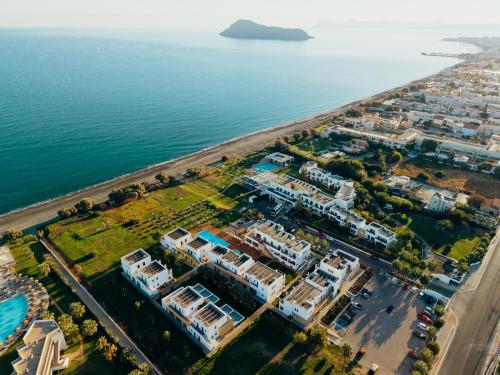 an aerial view of a villa next to the ocean at Geraniotis Hotel and Resort in Platanias