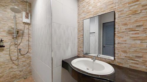 a bathroom with a sink and a mirror at LK Resort in Ban Map Khao Wan